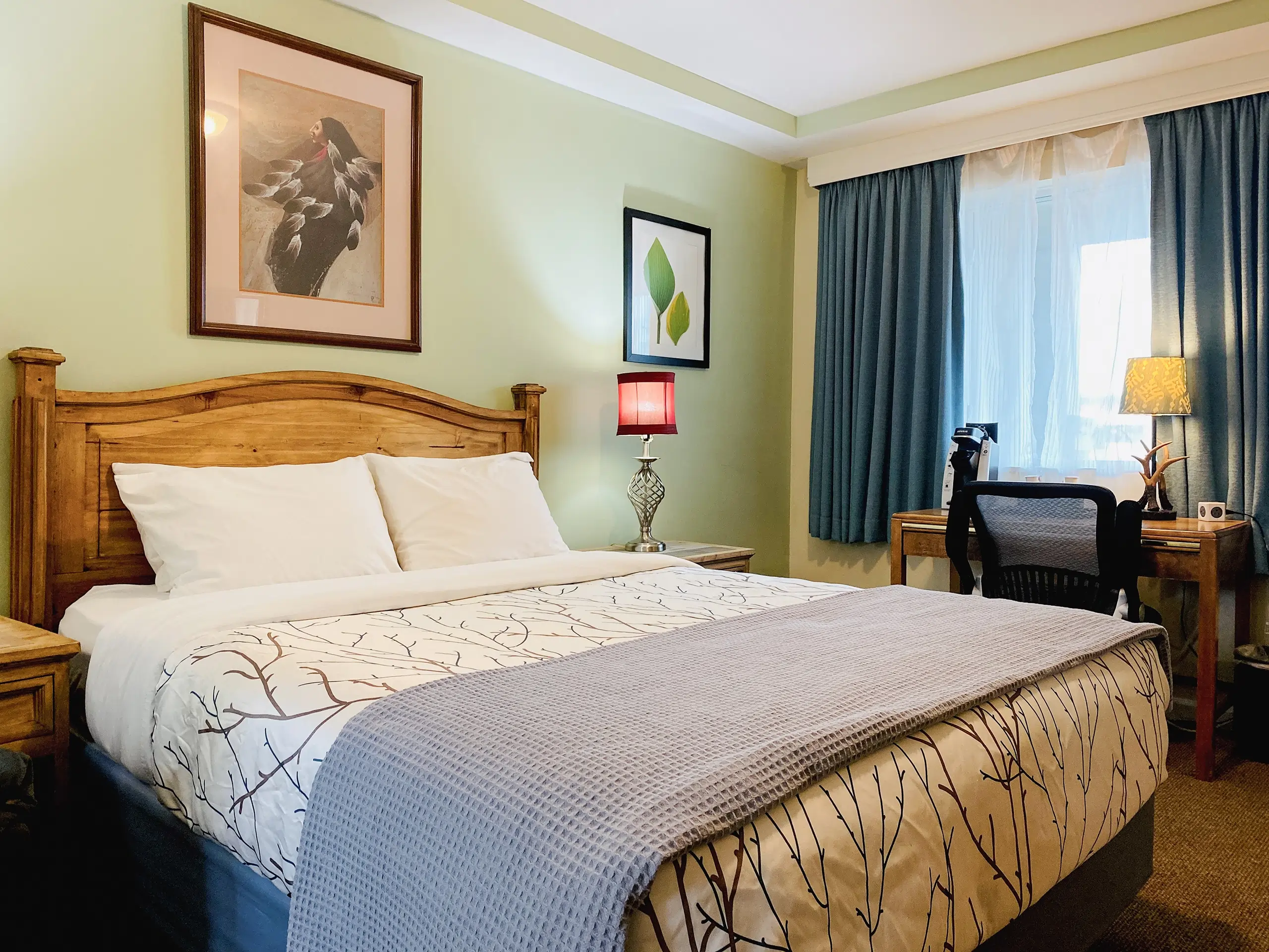 Standard Queen Bed in a decorated hotel room