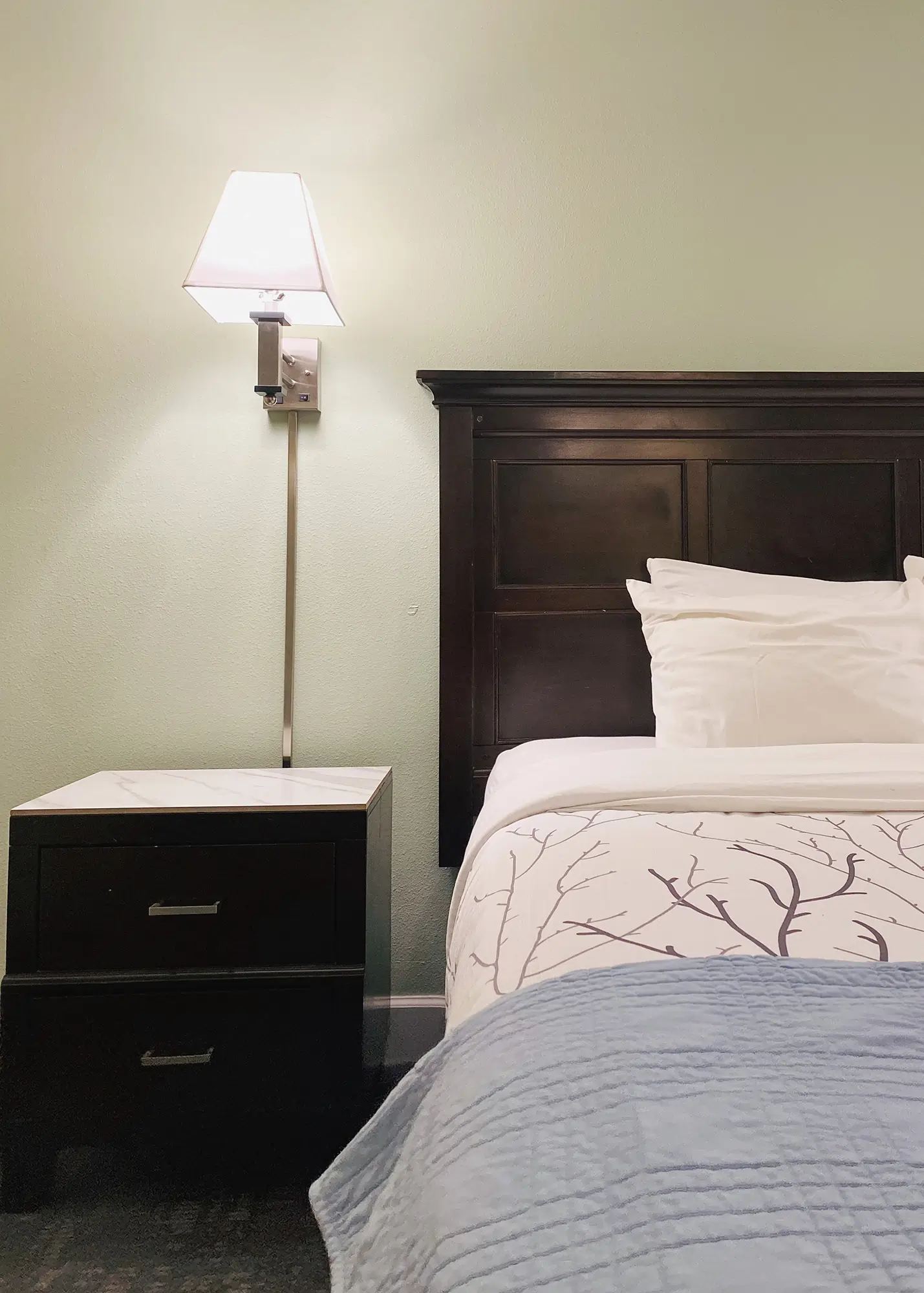 Closeup of king bed and nightstand