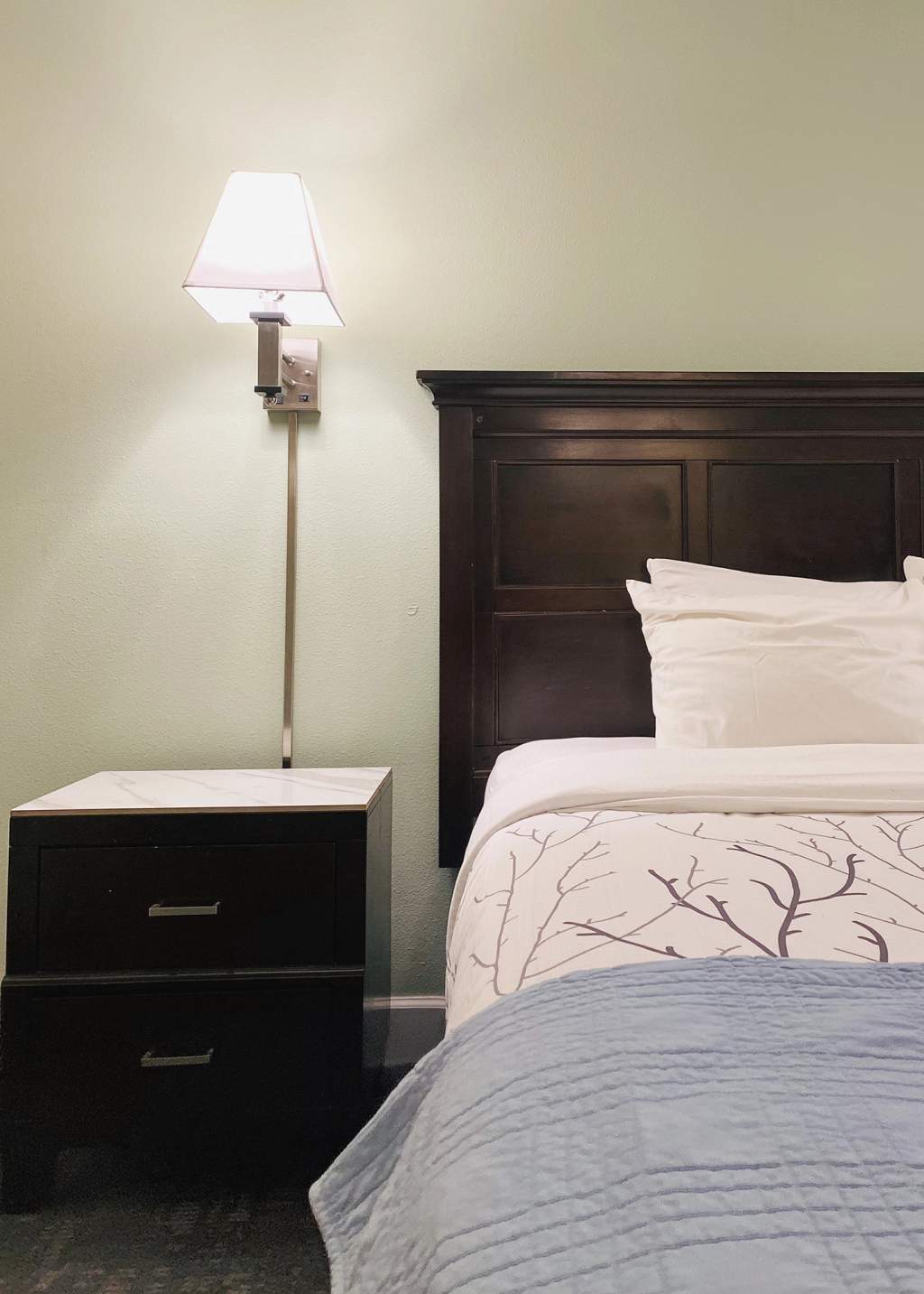 Closeup of king bed and nightstand